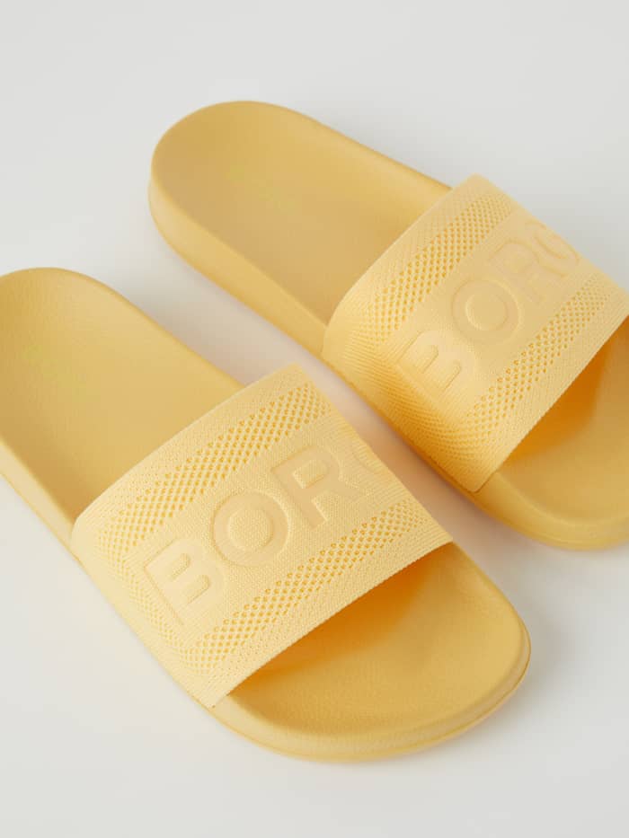 Yellow Women's Sandals Knox Knit featuring a flexible knit strap for a comfortable fit and a matching yellow Borg logo.