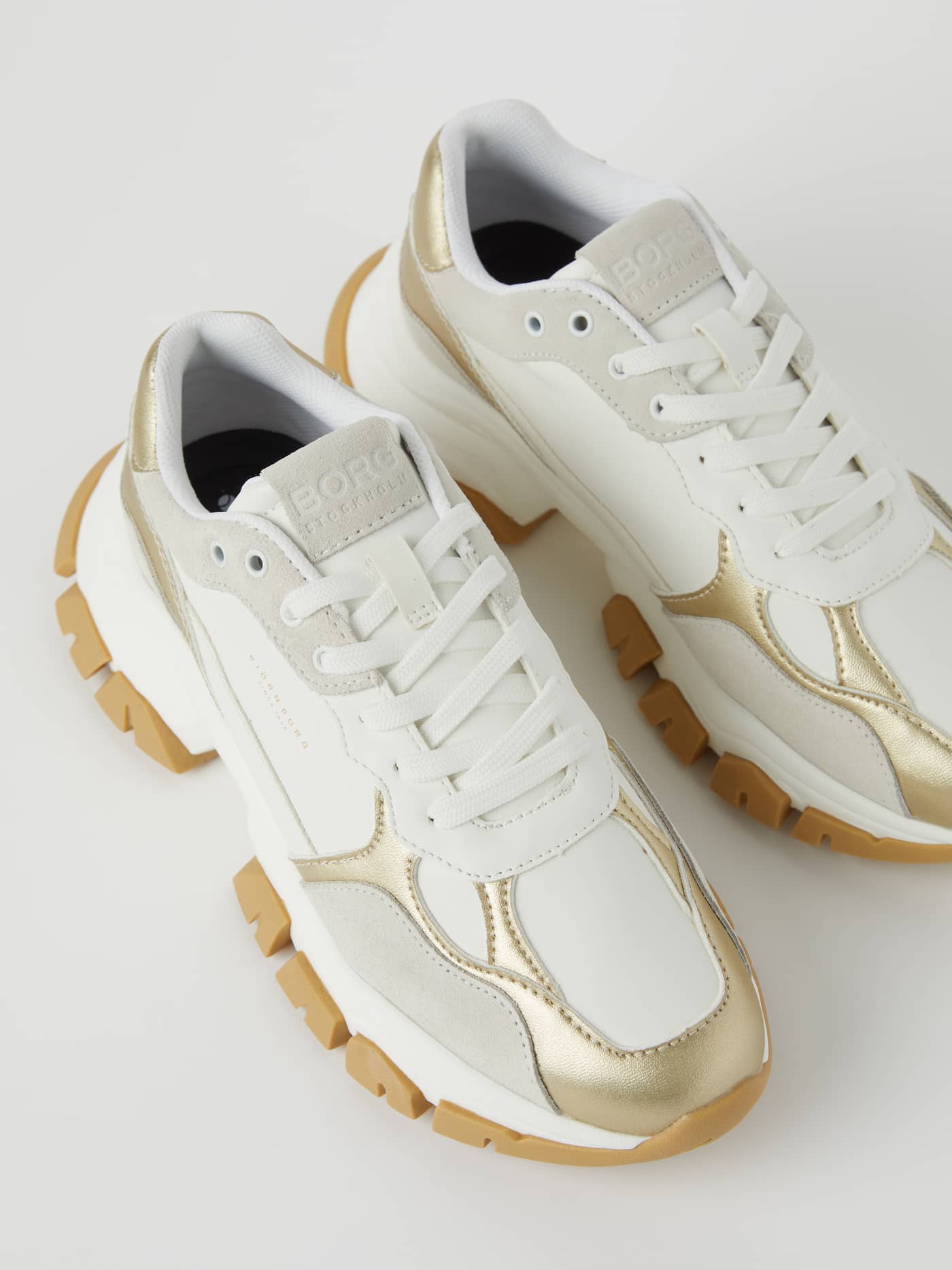 Women's Matt Metallic Sneakers R2600 in white, featuring bronze metallic accents and a chunky, durable rubber outsole. - Image 3