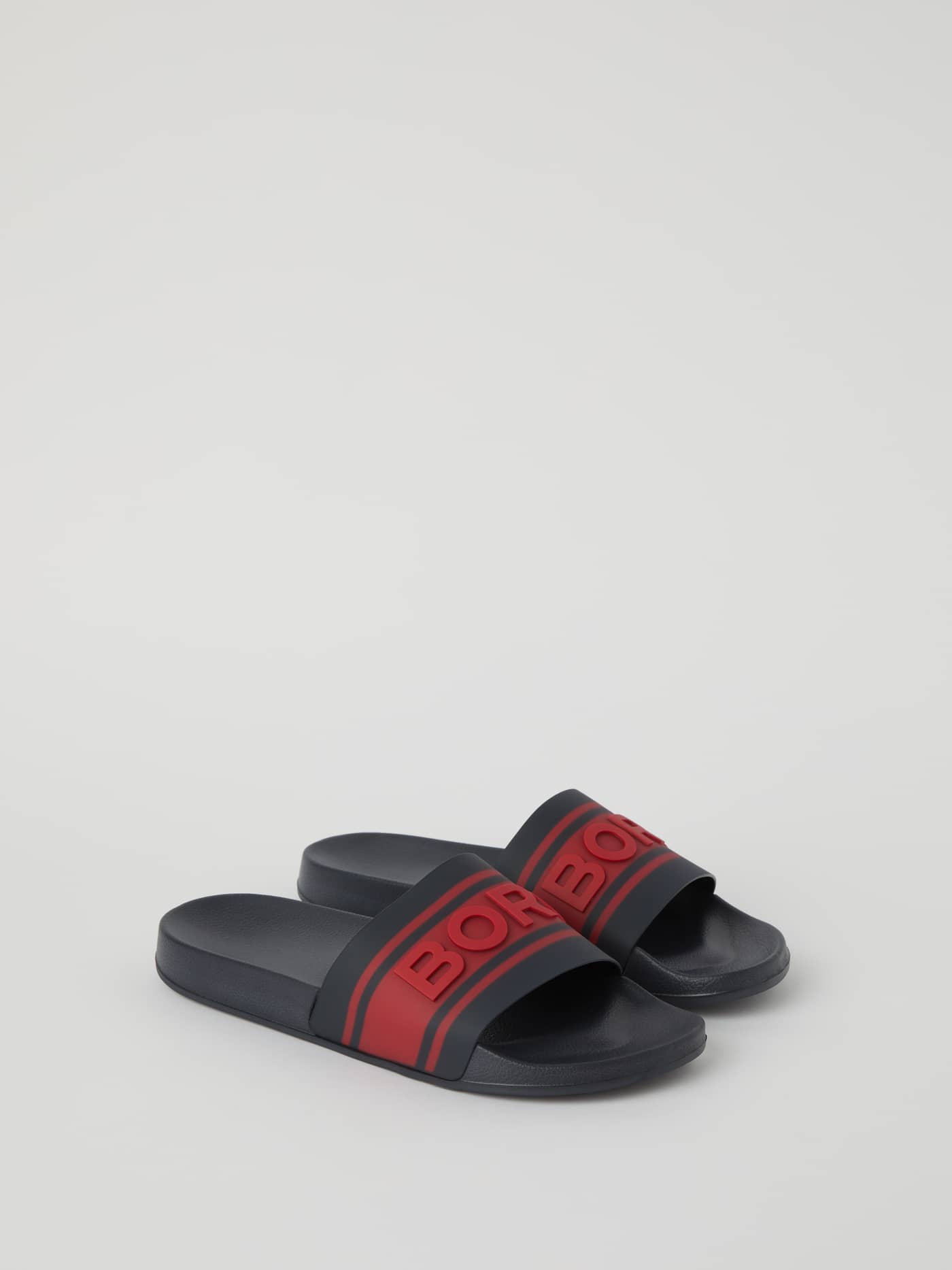 Knox Men's Molded Slides in navy featuring a red Borg logo, crafted from flexible TPU with a comfortable EVA outsole. - Image 1