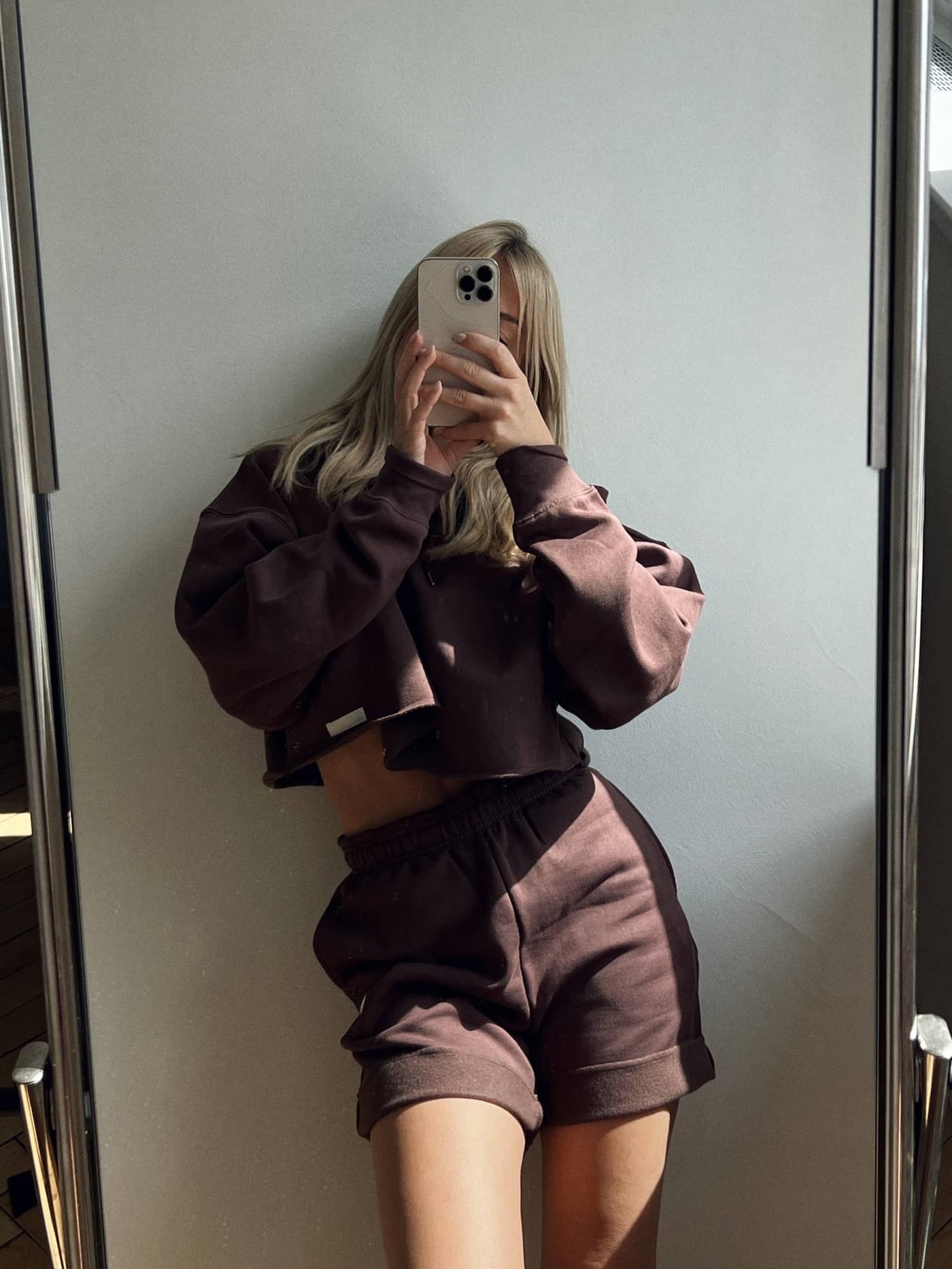 High-waisted Studio Oversized Shorts in French Toast (Brown) worn by a woman in a mirror selfie. - Image 4