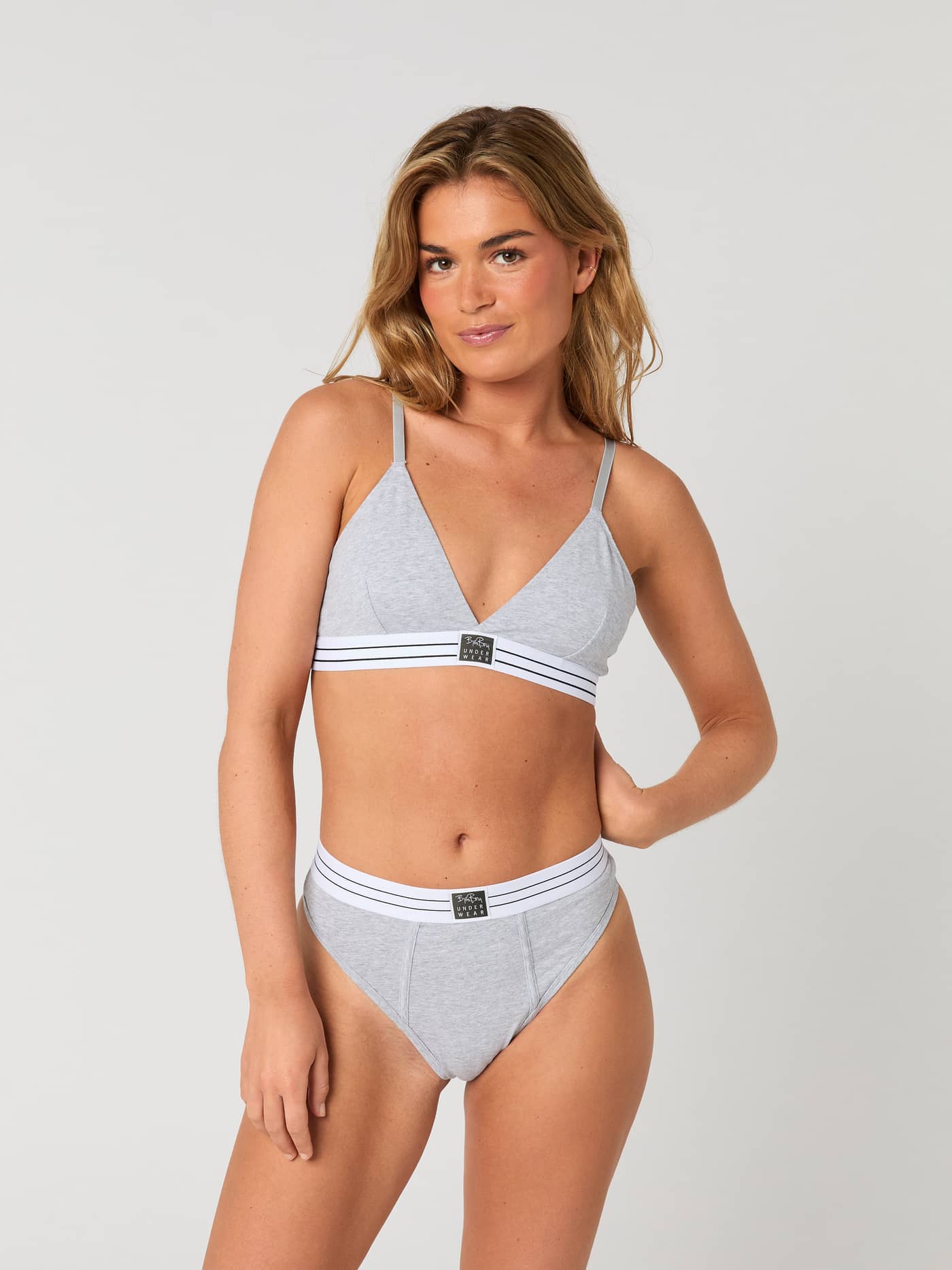Front view of a model wearing the grey Björn Borg Core Original High Waist Brief 2-pack with a black heritage logo label. - Image 3