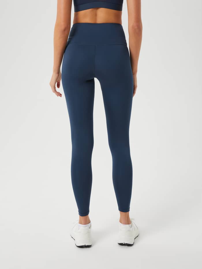 Back view of a model wearing Björn Borg Logo Tights in Midnight Navy (Navy) with a slim fit for training performance. - Image 3