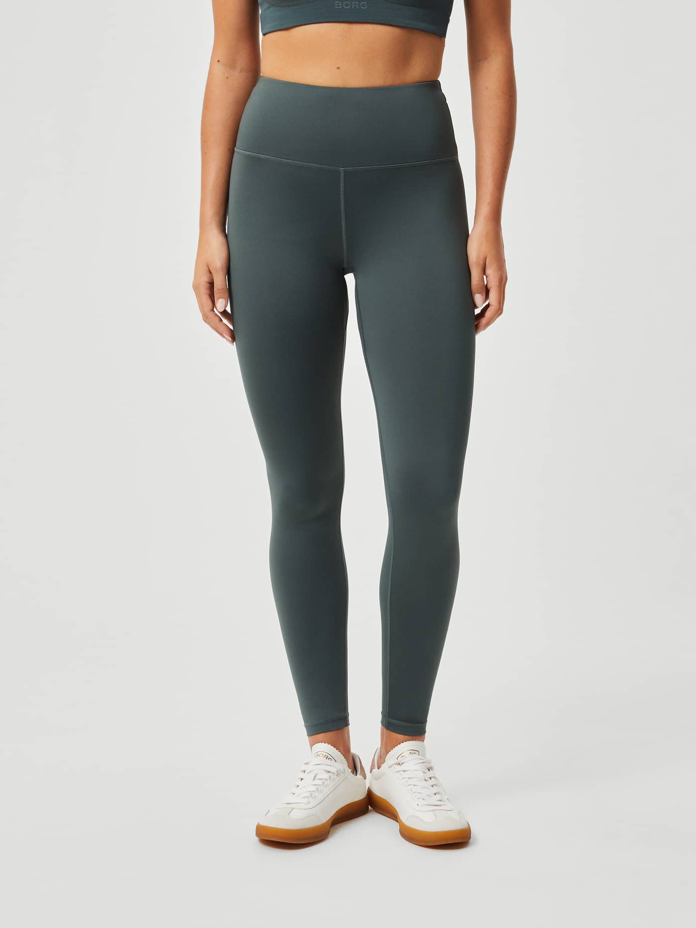 Front view of high-waisted, slim-fit Björn Borg Logo Tights in Urban Chic (Green) for women's training. - Image 2