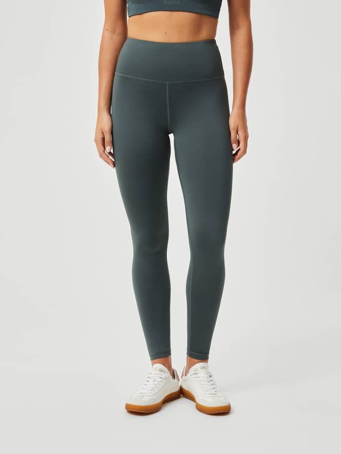 Front view of high-waisted, slim-fit Björn Borg Logo Tights in Urban Chic (Green) for women's training. - Image 2