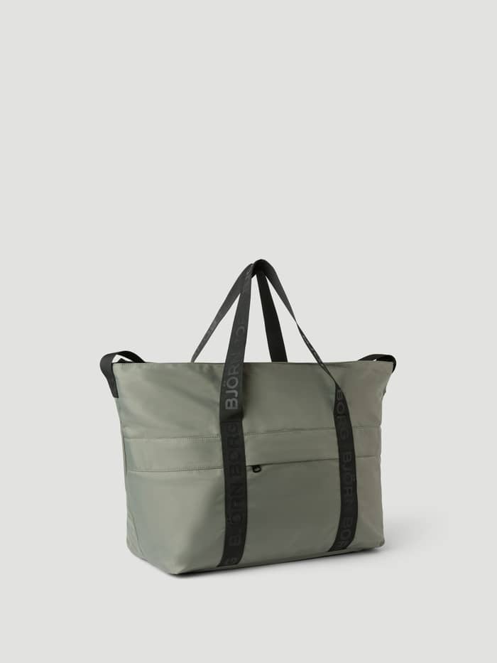 Front view of the Borg Classic Tote 27L in Agave Green (Green), a training bag with black logo straps and zip pockets. - Image 2