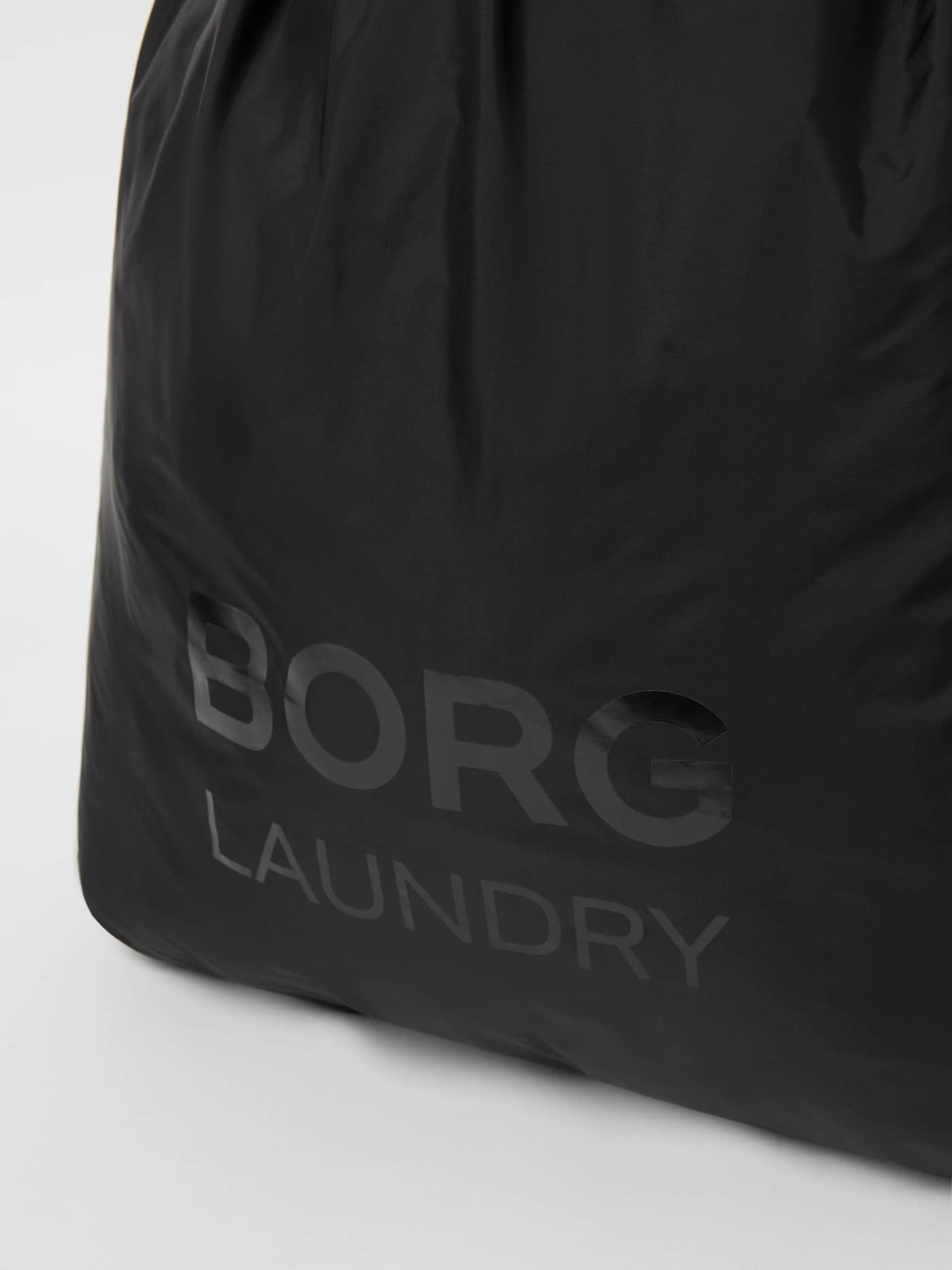 Close-up of the Borg Travel Laundry Bag in Black Beauty (Black) featuring a tonal logo print on recycled polyester. - Image 3