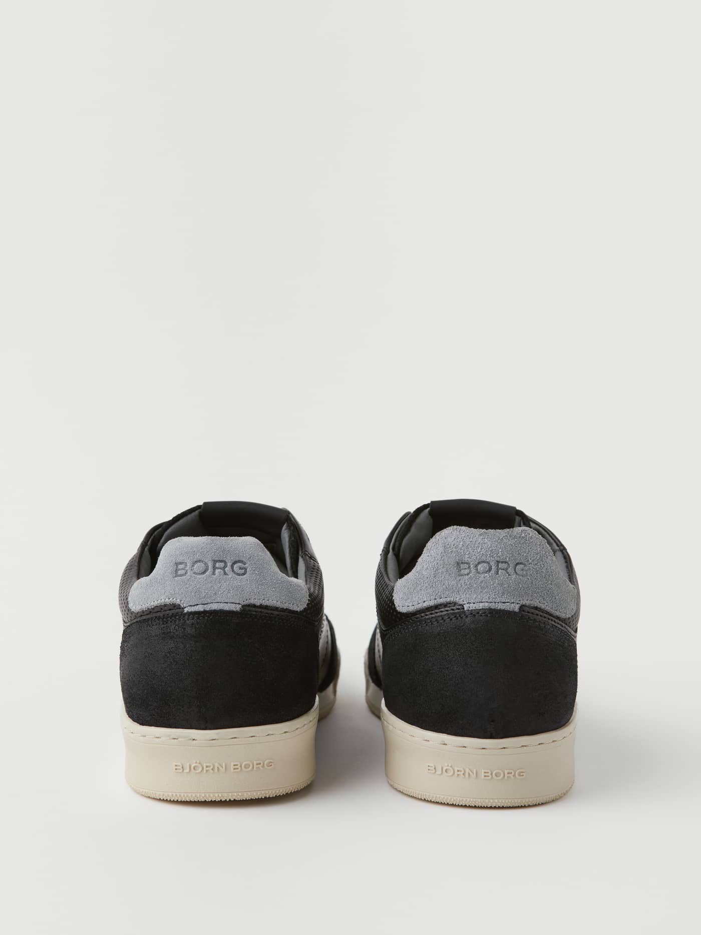 Back view of the Men's Leather Sneaker Sl200 in Black, featuring grey suede heelcaps and cream outsoles. - Image 2