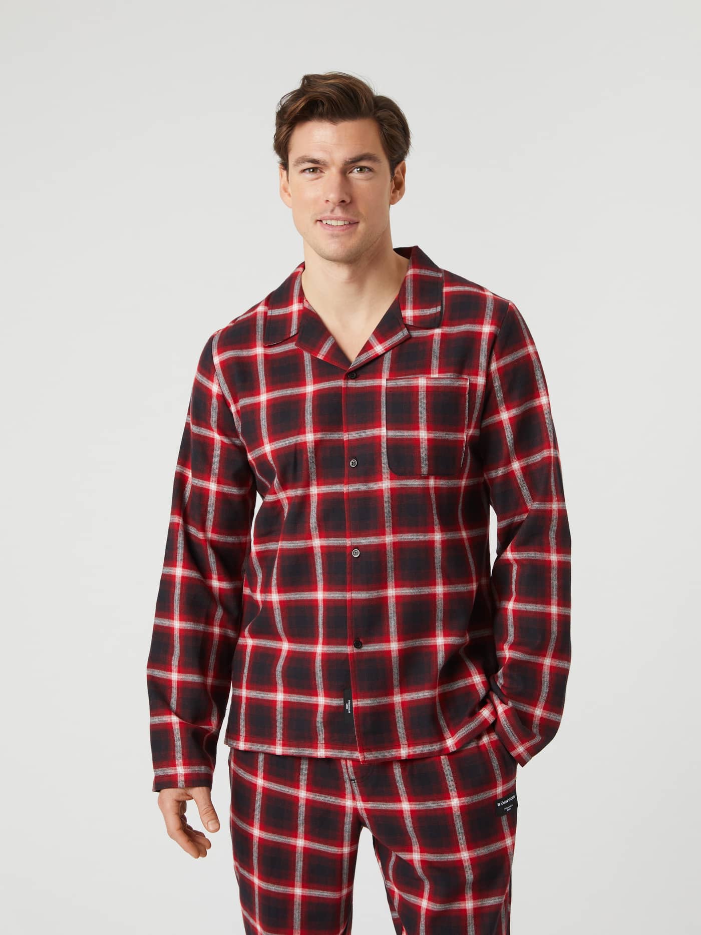 Model from the front wearing the red and black checked Björn Borg Core Flannel Pyjama Shirt. - Image 1