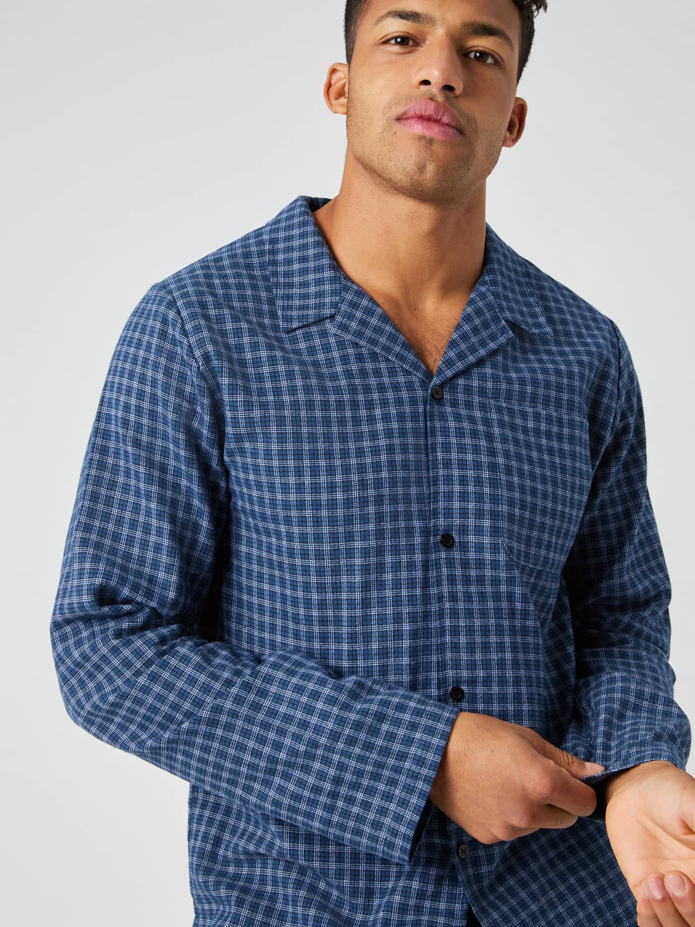 Close-up of a model wearing the blue multi-check Björn Borg Core Flannel Pyjama Shirt. - Image 1
