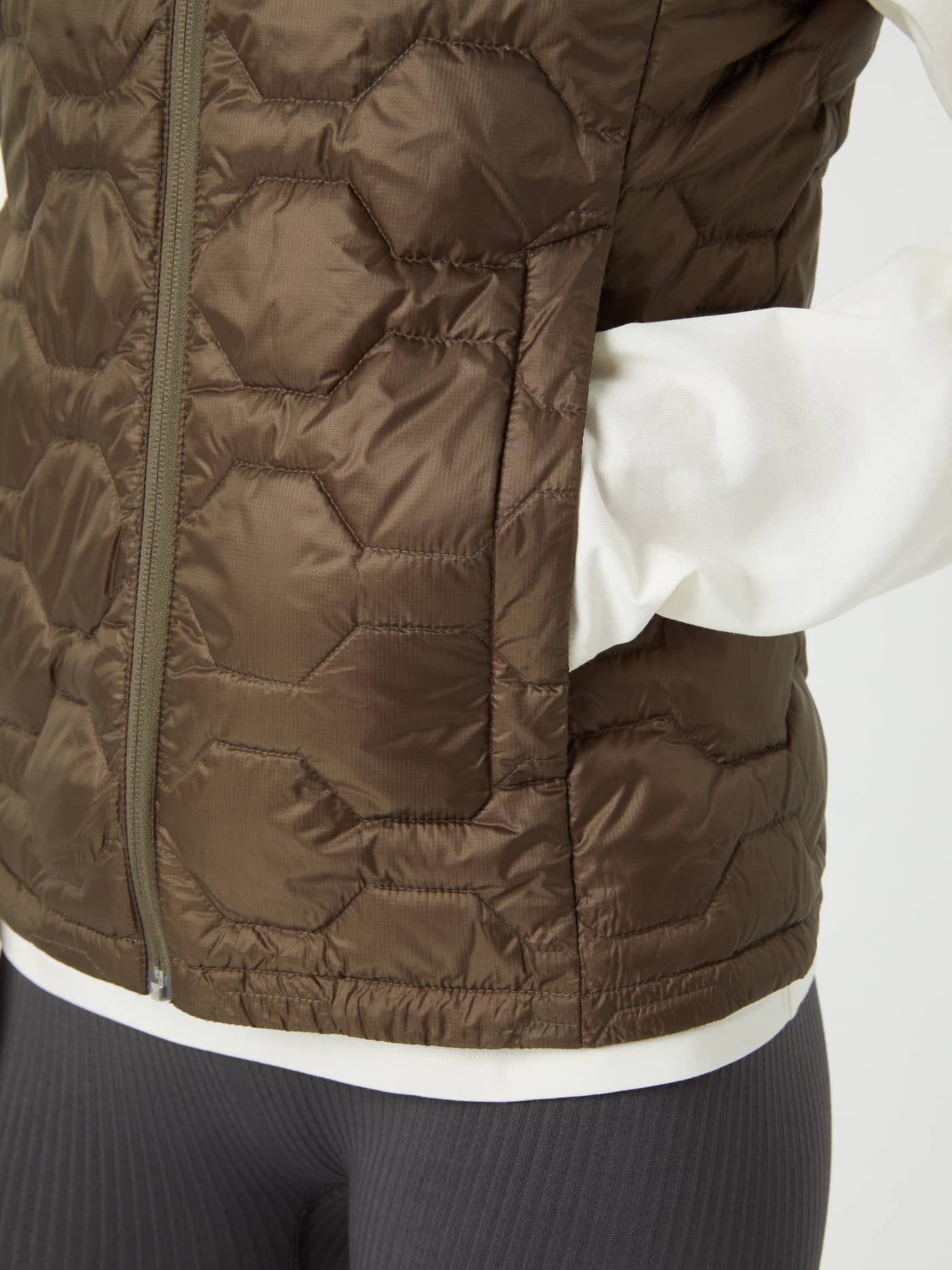 Borg Down Liner Vest in Tarmac (Brown) for women, featuring a quilted ripstop design and functional side pocket. - Image 6