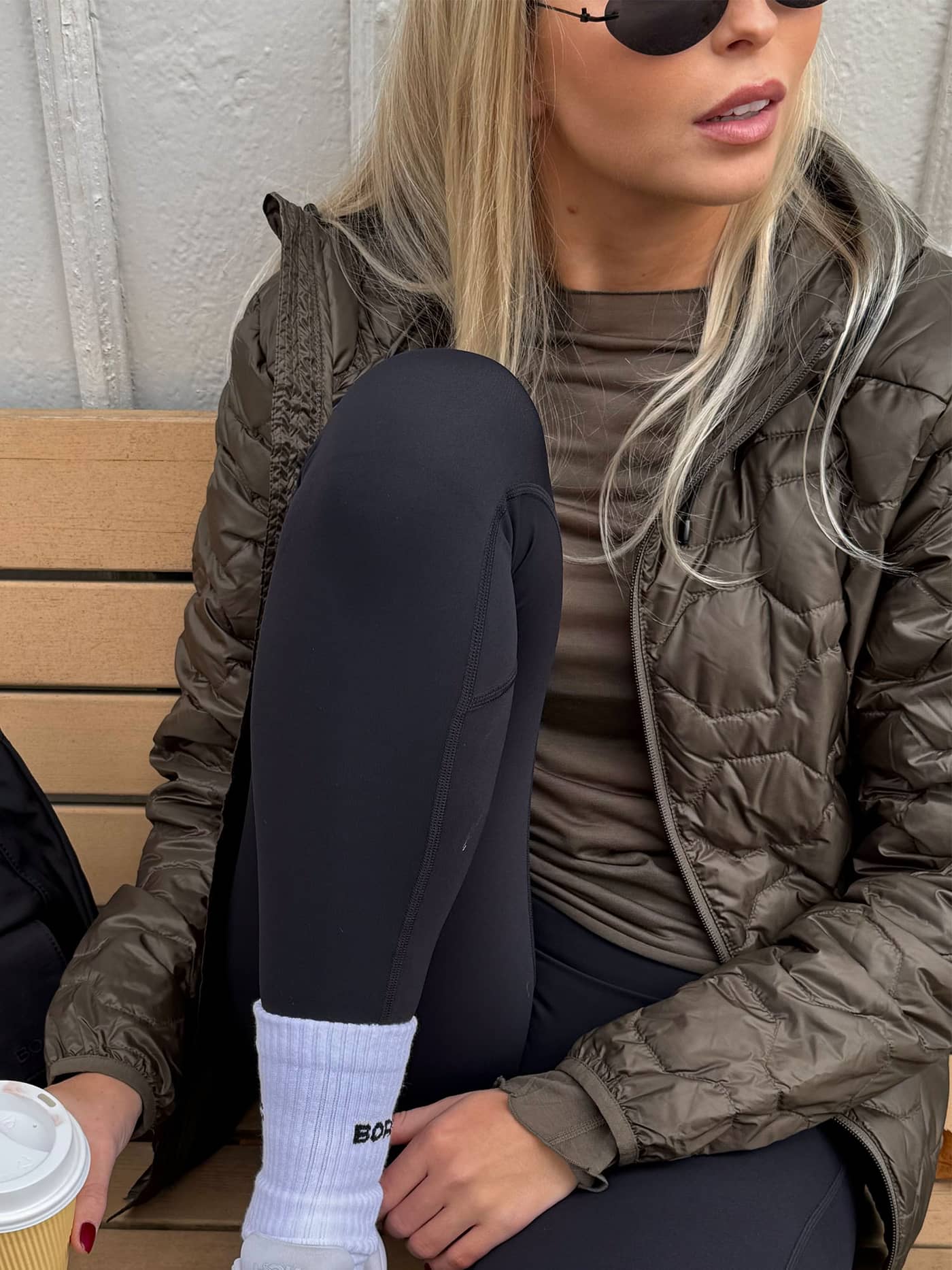 Quilted Borg Down Liner Jacket in Tarmac (Brown) worn by a woman, featuring a stylish fit and lightweight performance. - Image 6