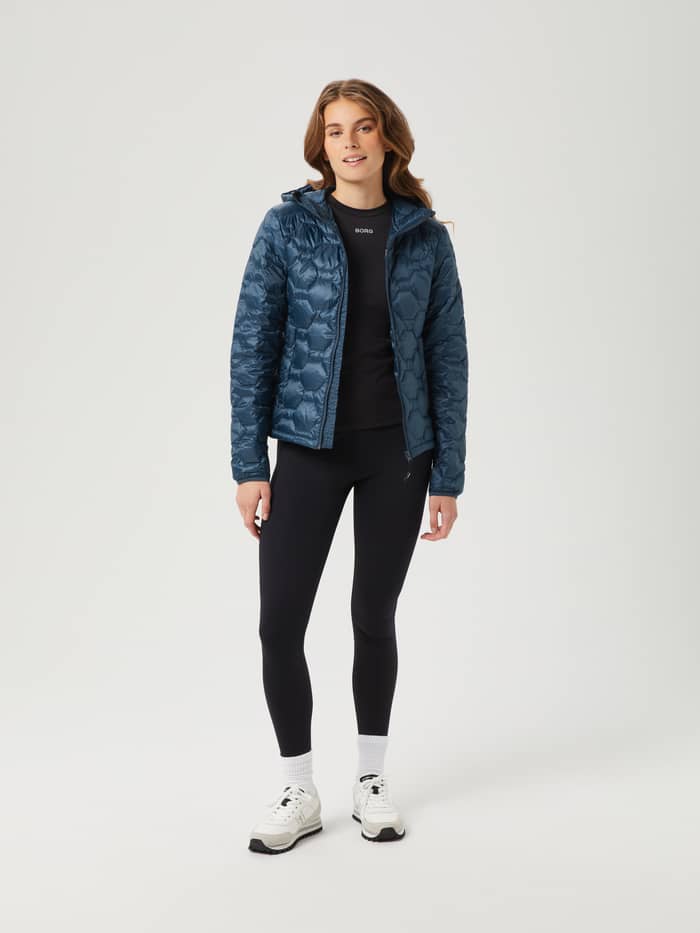 Full-body front view of a woman in the Björn Borg Down Liner Jacket in Midnight Navy (Navy). - Image 3