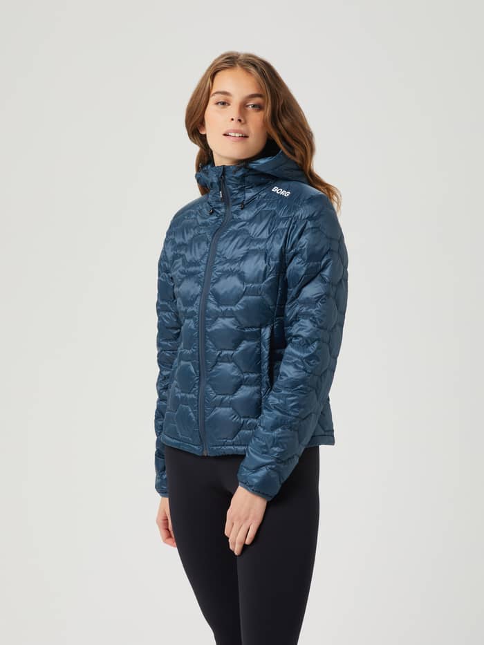 Front view of a model wearing the Midnight Navy (Navy) Björn Borg Down Liner Jacket with a white logo and quilted finish. - Image 2