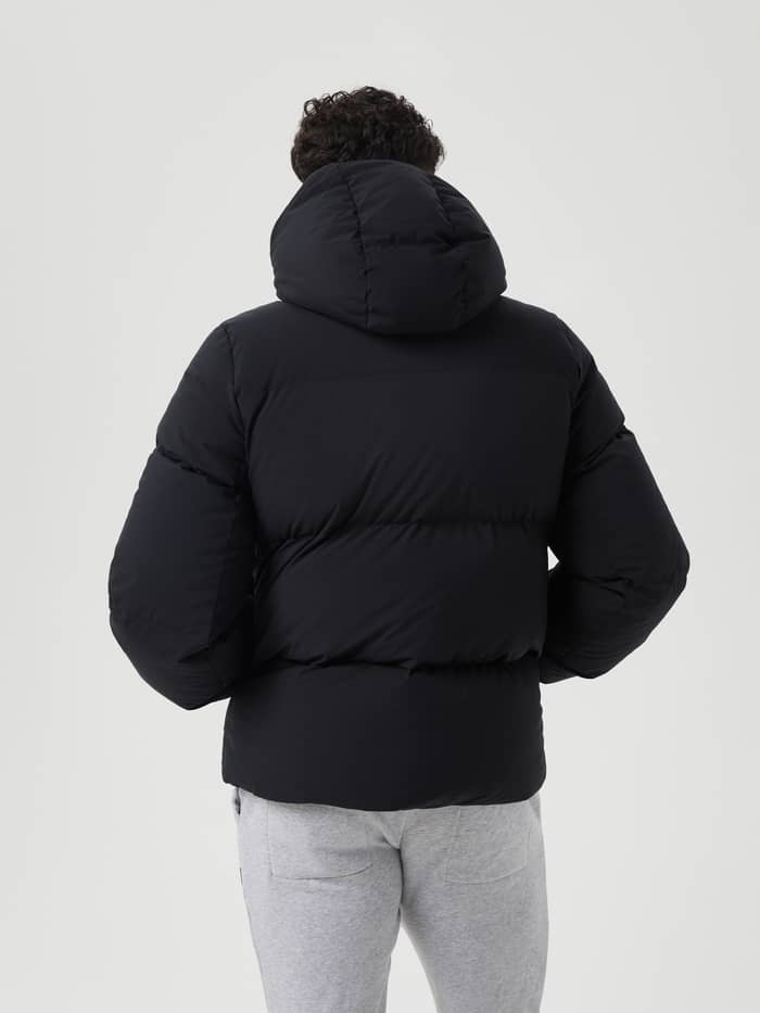Back view of a man in the stylish and functional, down-filled Björn Borg Centre Puffer Jacket in Black Beauty (Black). - Image 3