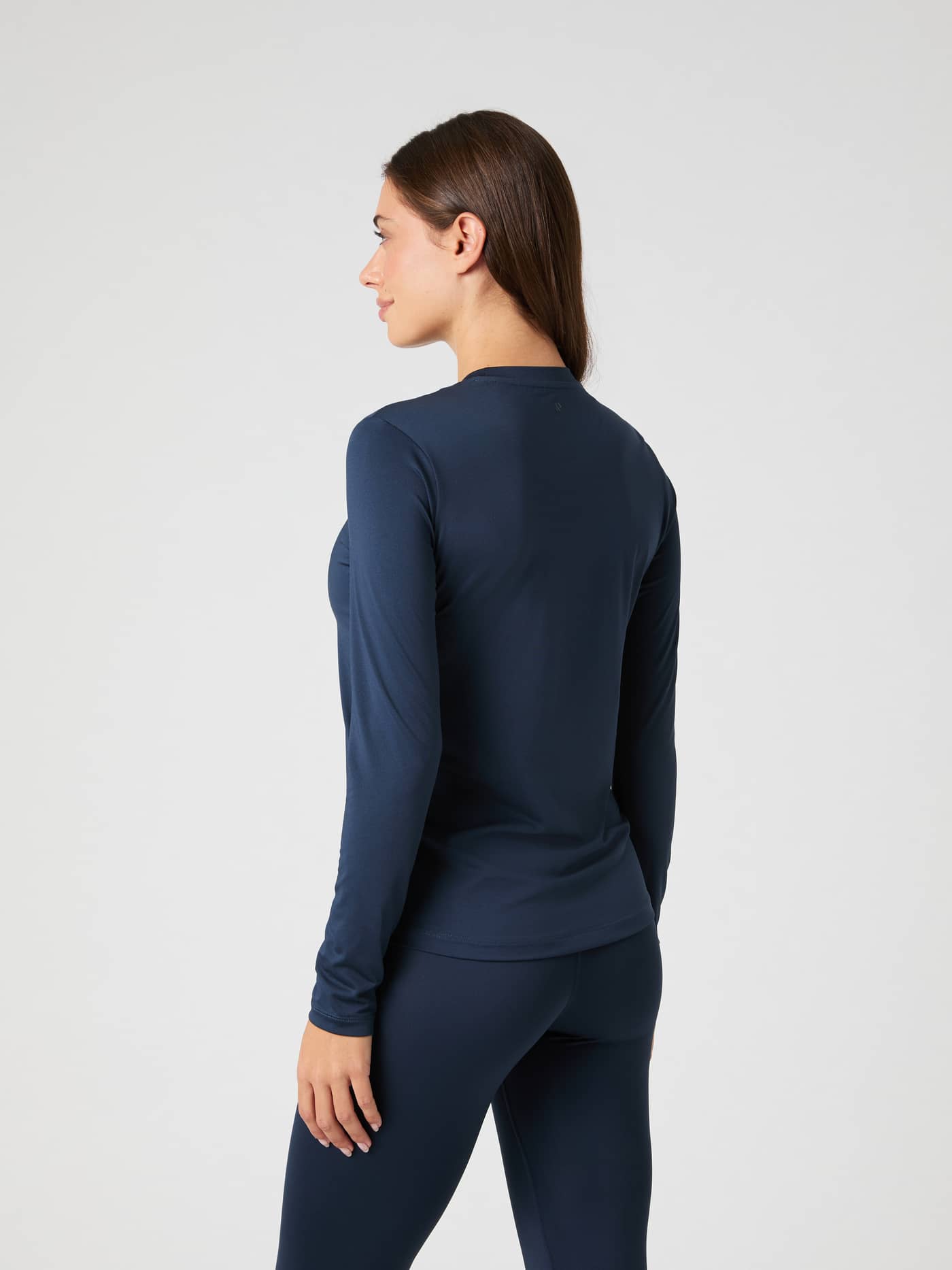 Back view of a woman wearing the navy blue Borg Long Sleeve T-shirt. - Image 2