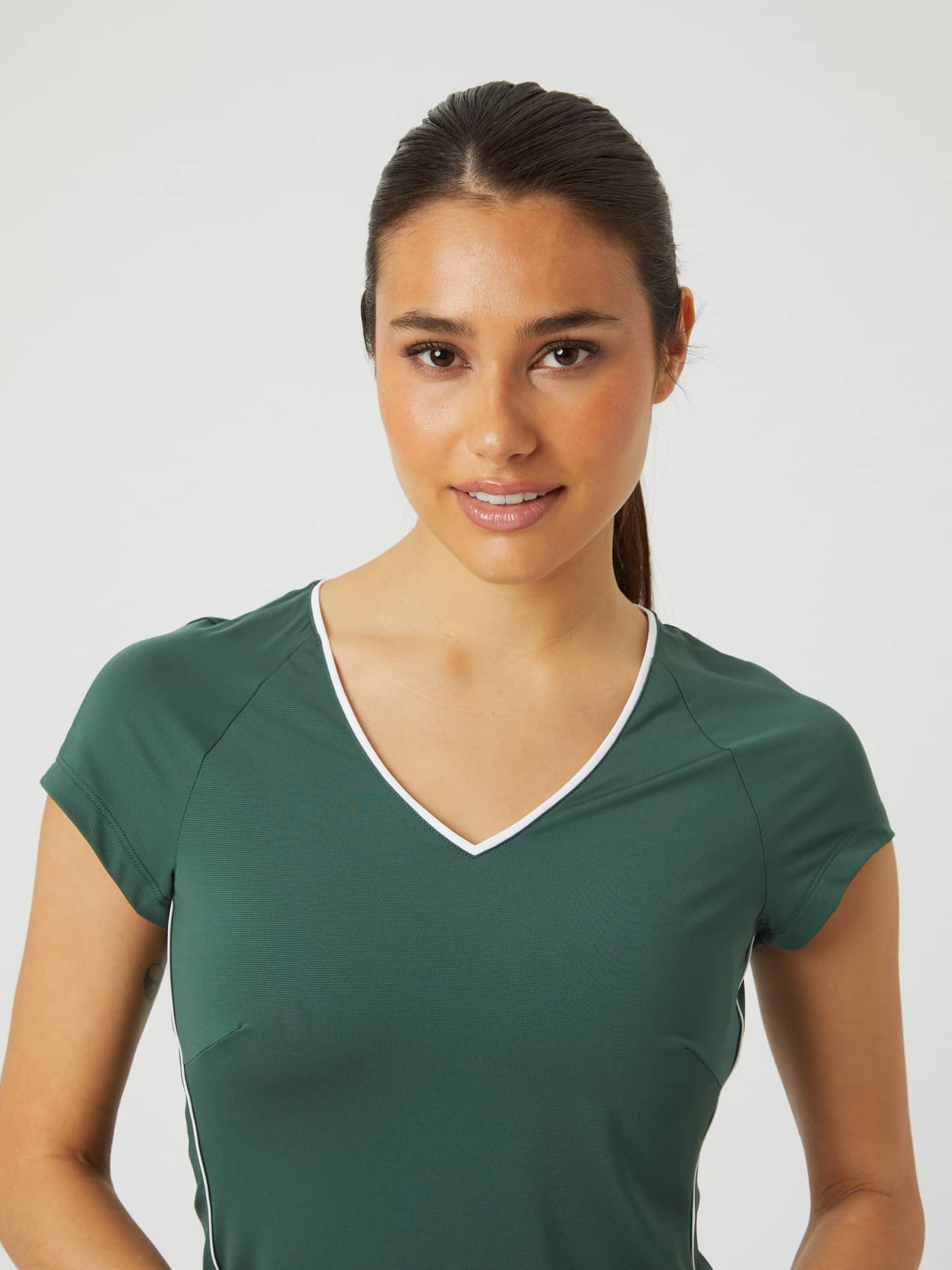 Front view of a model in the slim-fit Björn Borg Ace V T-Shirt in Cilantro (Green), designed for tennis. - Image 1