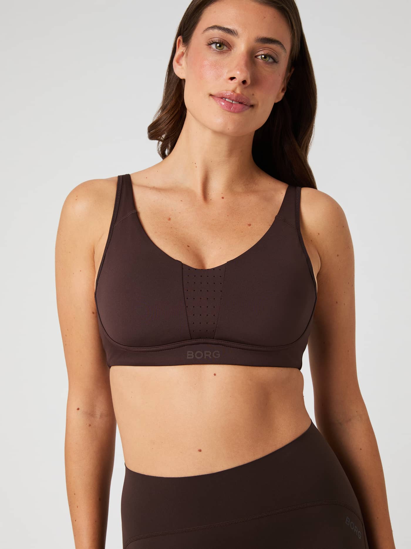 Model shown from the front wearing the brown Borg Reform Sports Bra. - Image 4
