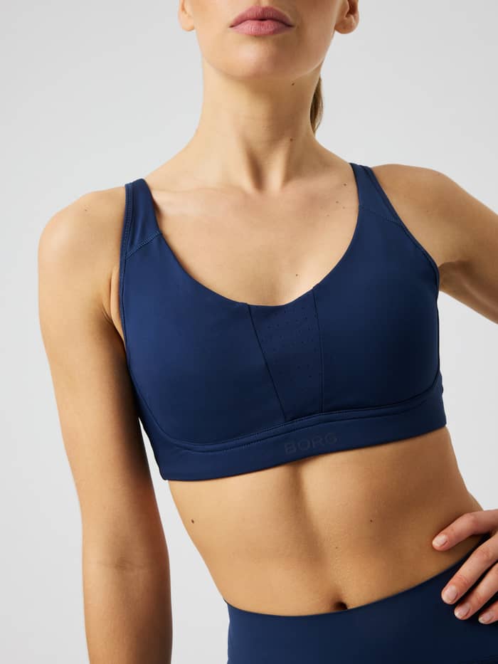 Vue de face du Borg Reform Sports Bra en Dress Blues (marine) avec un design d'entraînement et une structure de maintien.