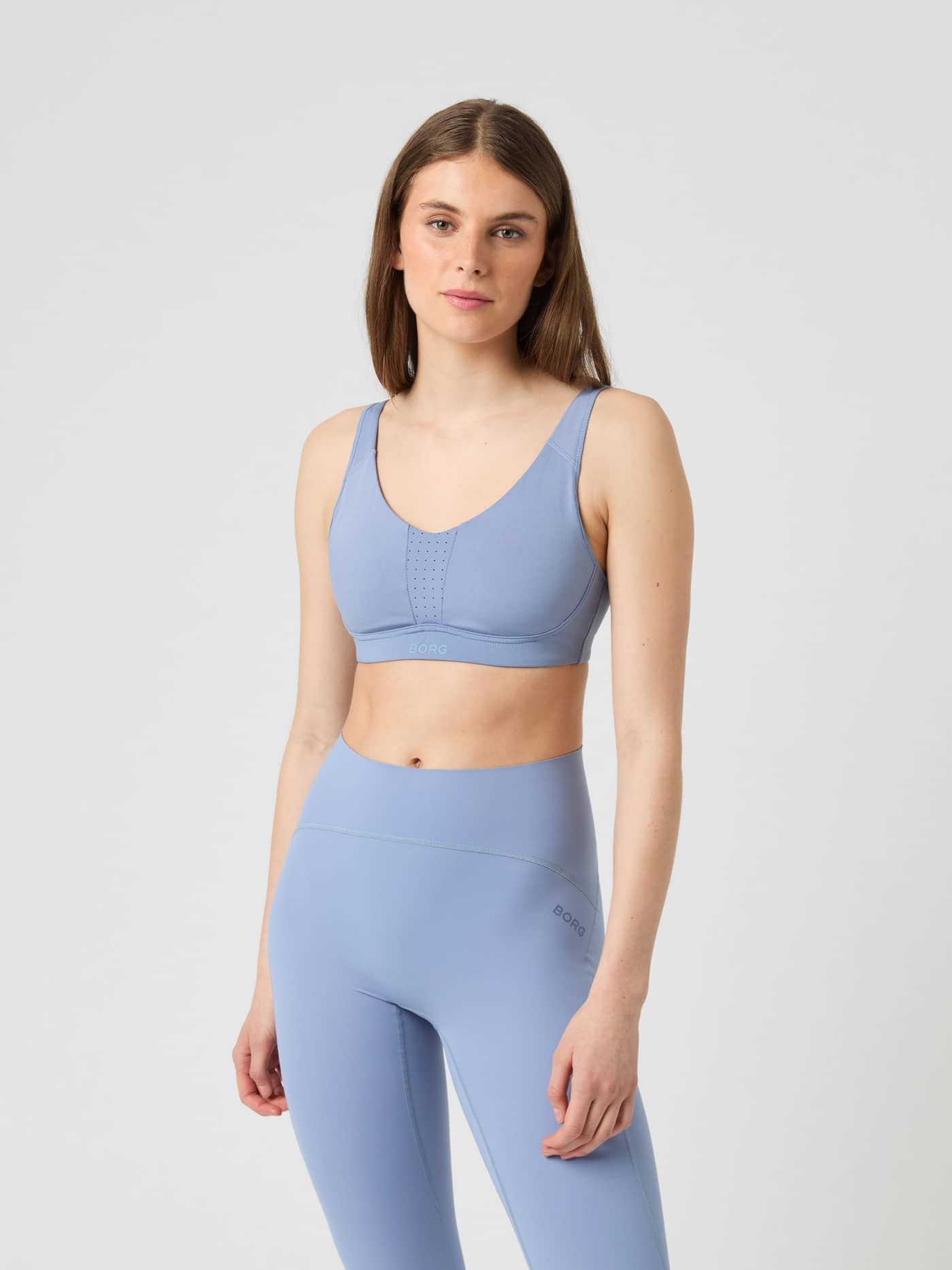 Front view of a model wearing the light blue Borg Reform Sports Bra. - Image 3