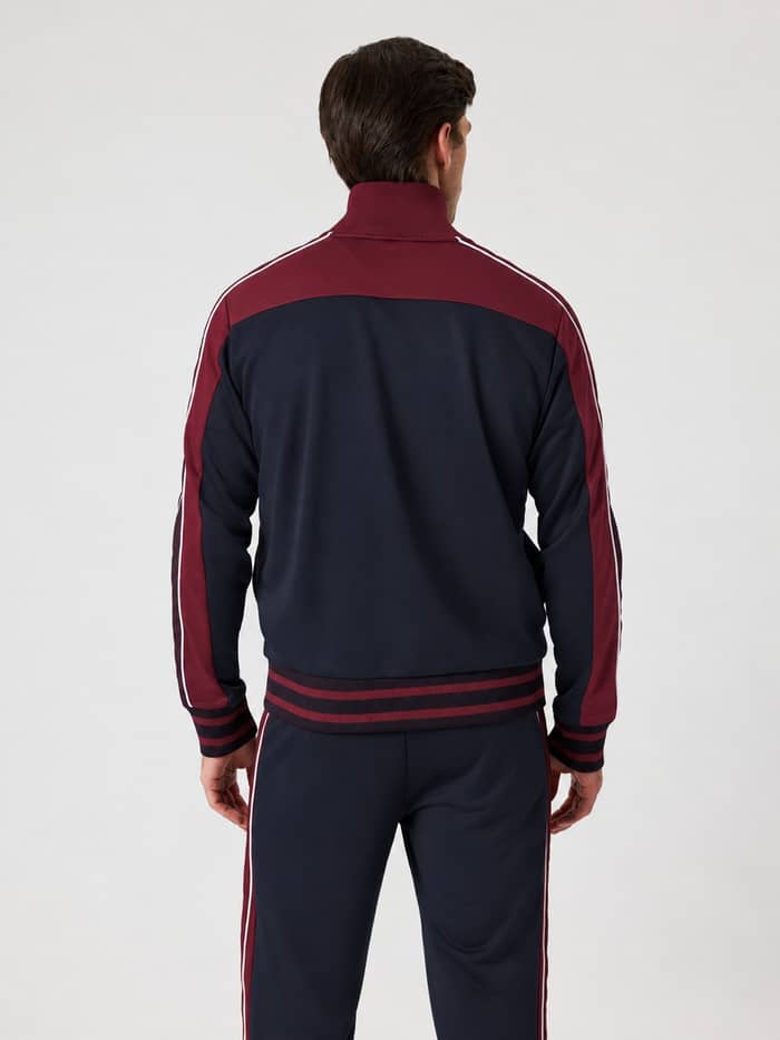 Back view of the Ace Retro Track Jacket in Night Sky (Navy) featuring contrasting panels and striped ribbed cuffs.