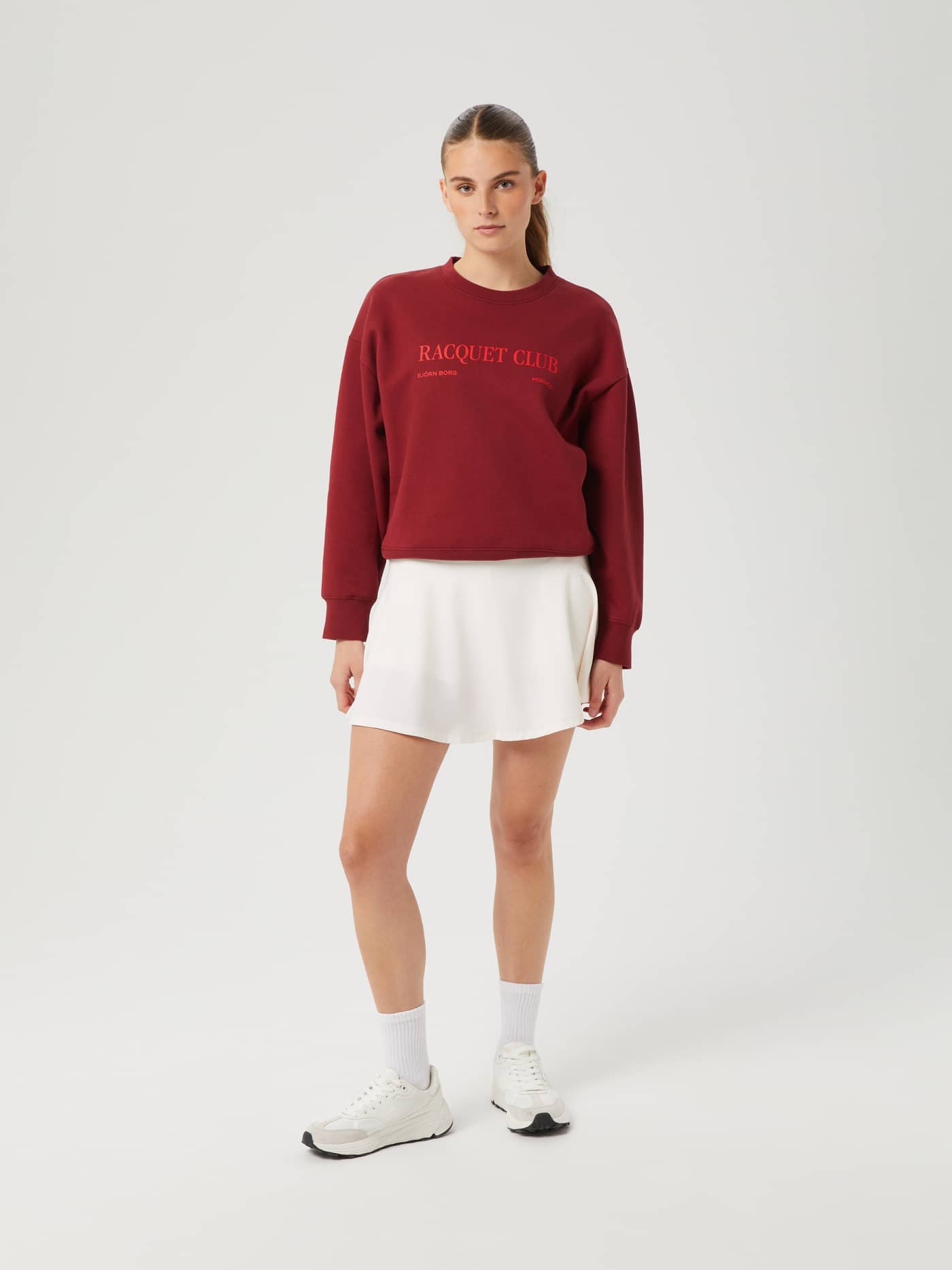 Full-body front view of a woman wearing the fleece Borg Boyfriend Crew in Pomegranate (Red) with a relaxed, oversized fit. - Image 5