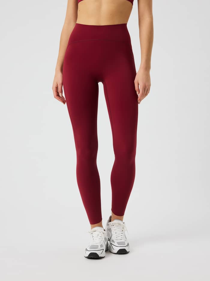Front view of the Borg Sleek Tights in Cabernet (Red) for training, featuring a high waist and slim fit.