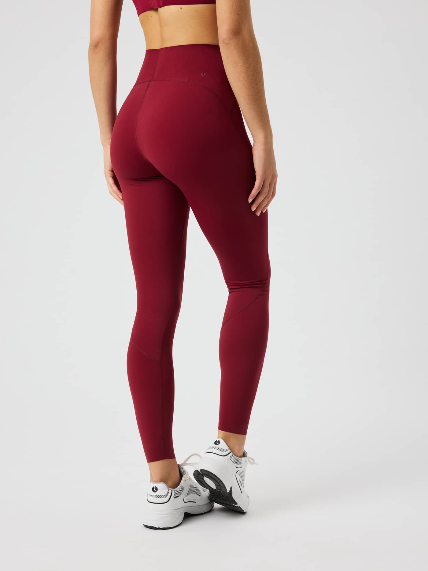 Back view of the Borg Sleek Tights in Cabernet (Red) for training, showcasing the high-waisted slim fit. - Image 3