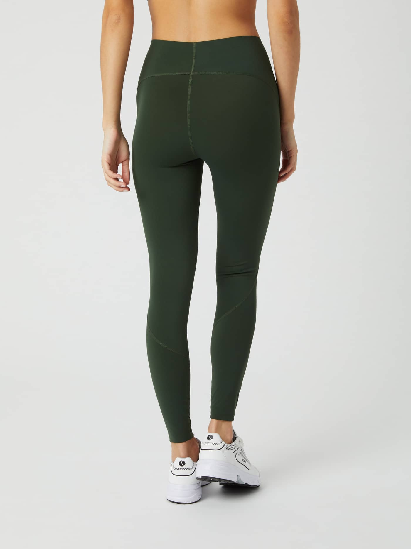 Back view of a model wearing the Björn Borg Borg Sleek Tights in Duffel Bag green against a white background. - Image 3