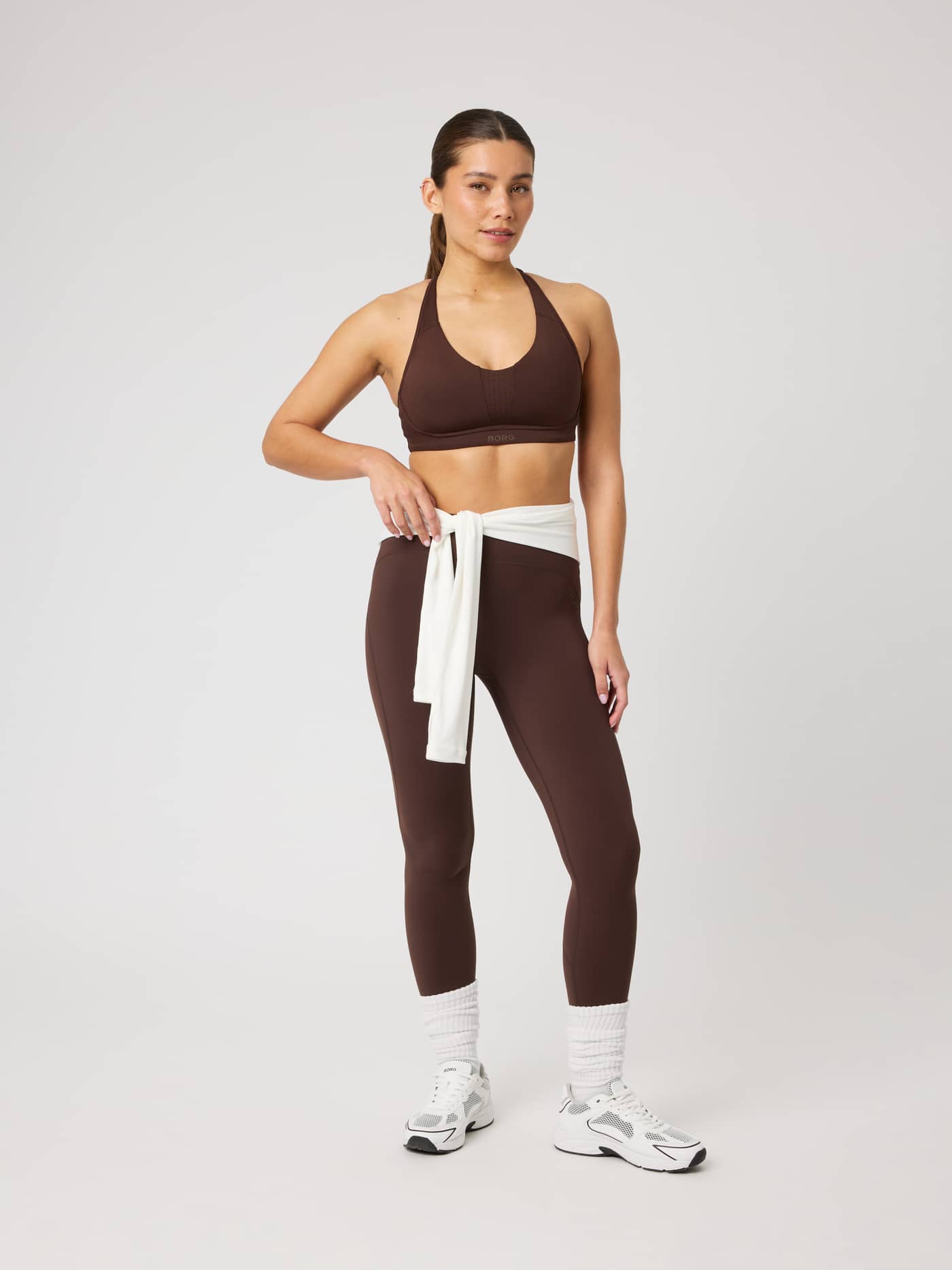 Full-body front view of a model wearing high-waisted Borg Sleek Tights in Coffee Bean (Brown) for training. - Image 3