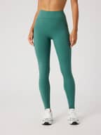 Front view of a model wearing high-waisted Borg Sleek Tights in Mallard Green (Green) for training style and a slim fit.