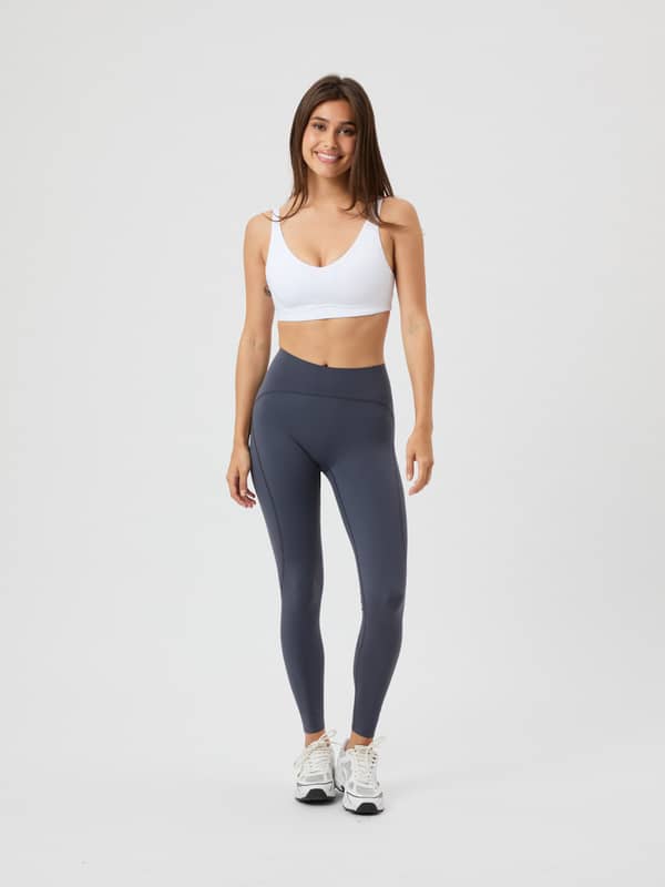Borg Sleek Tights in Odyssey Gray (Grijs) met een slanke pasvorm voor training, getoond in een volledig vooraanzicht.