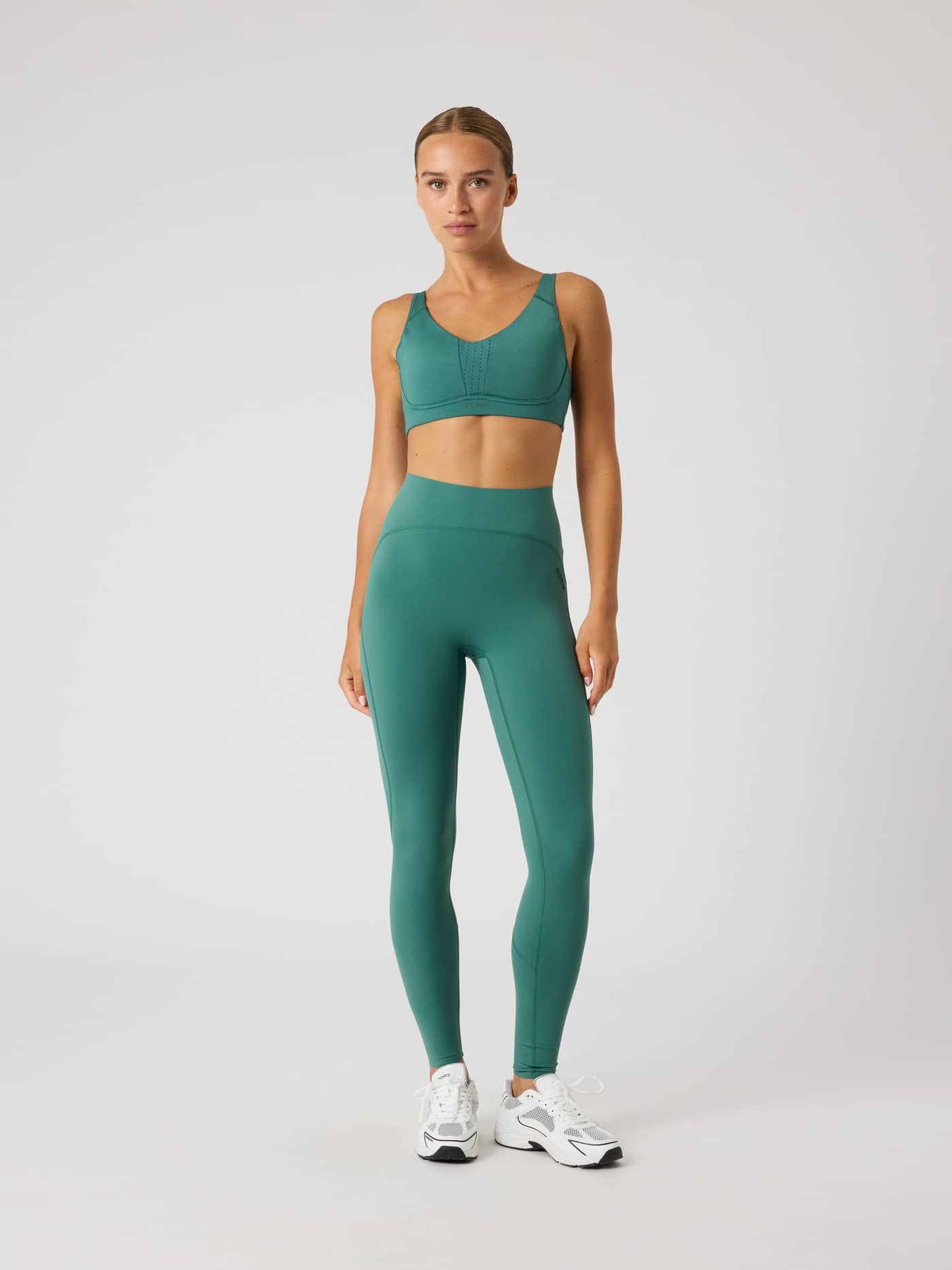 Full-body front view of a model wearing high-waisted Mallard Green (Green) Borg Sleek Tights for women's training. - Image 3