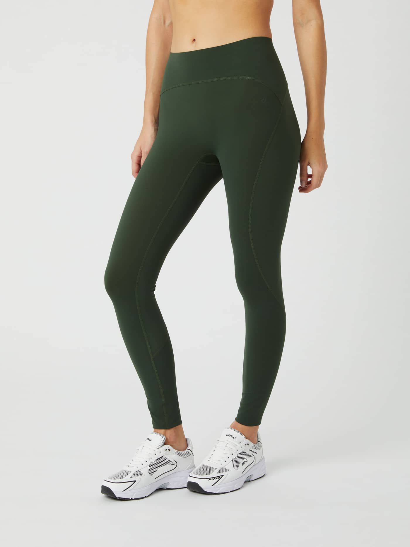 Side view of a model wearing the Borg Sleek Tights in the color Duffel Bag. - Image 2