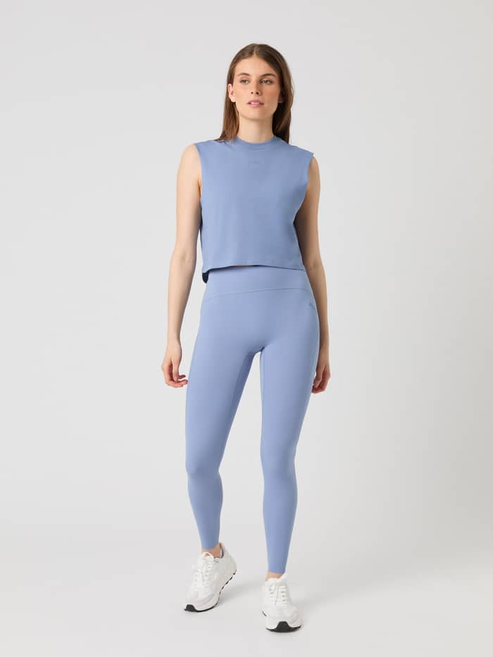 Front view of a model wearing the Björn Borg Borg Sleek Tights in stonewash blue. - Image 2