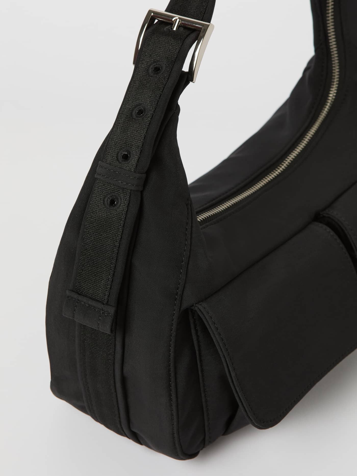 Close-up of the Borg Cargo Shoulder Bag in Black Beauty (Black) featuring an adjustable strap and cargo pockets. - Image 2