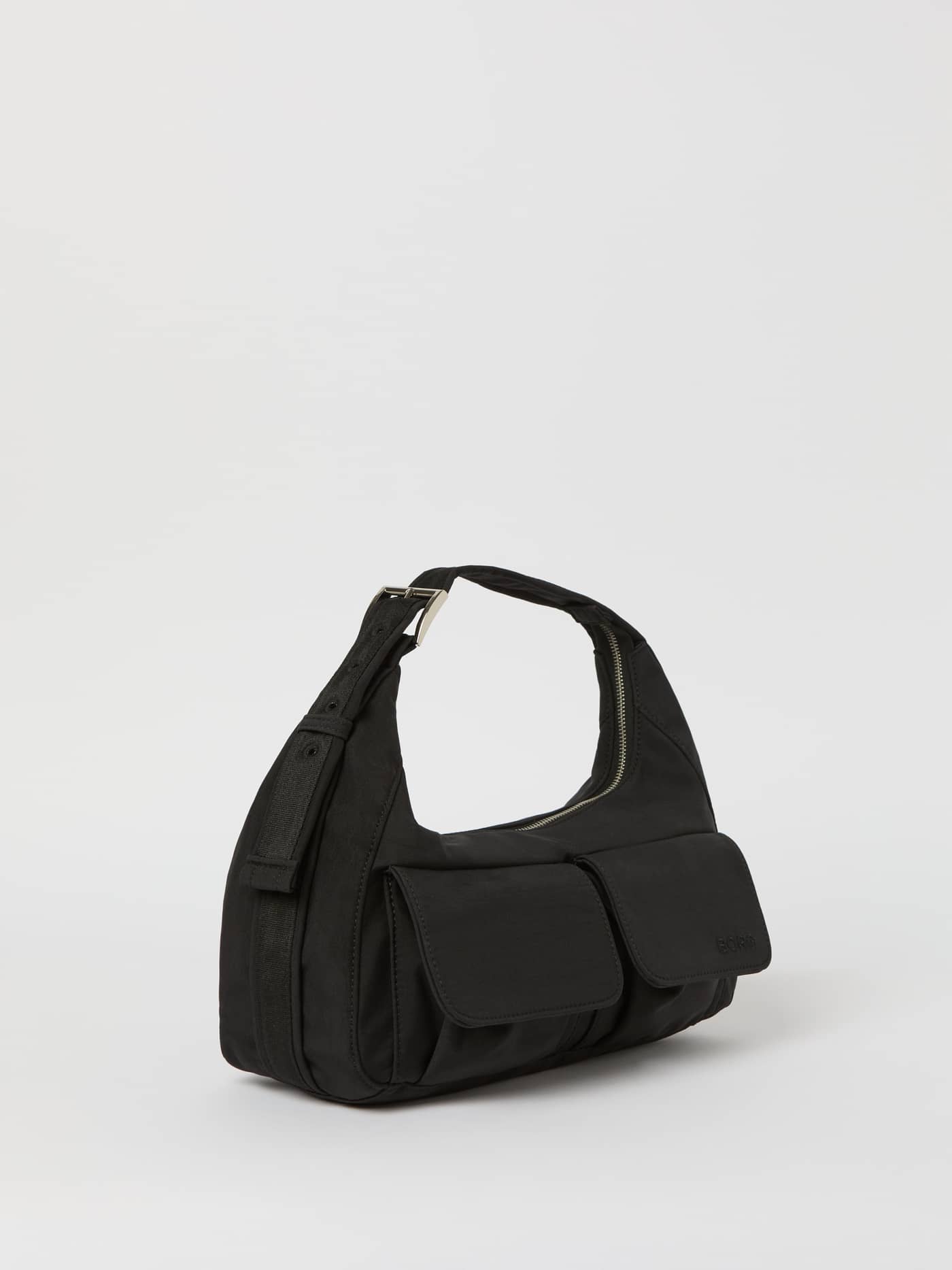 Side view of the Borg Cargo Shoulder Bag in Black Beauty (Black) featuring two cargo pockets and a tonal black logo. - Image 1
