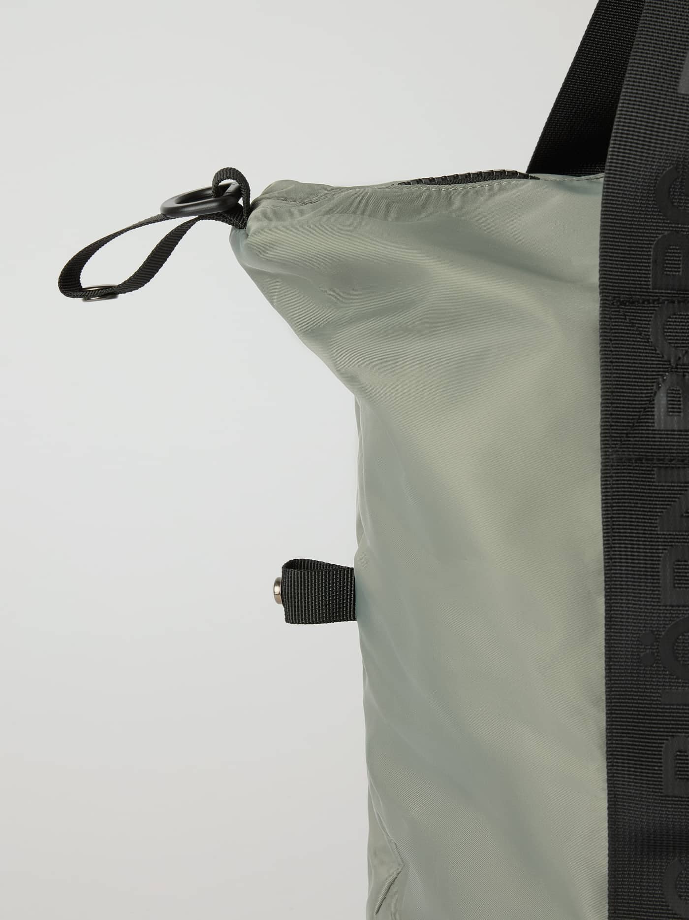Side view of the Agave Green (Green) Borg Classic Sports Bag 28L for training, featuring black branded hand straps. - Image 5