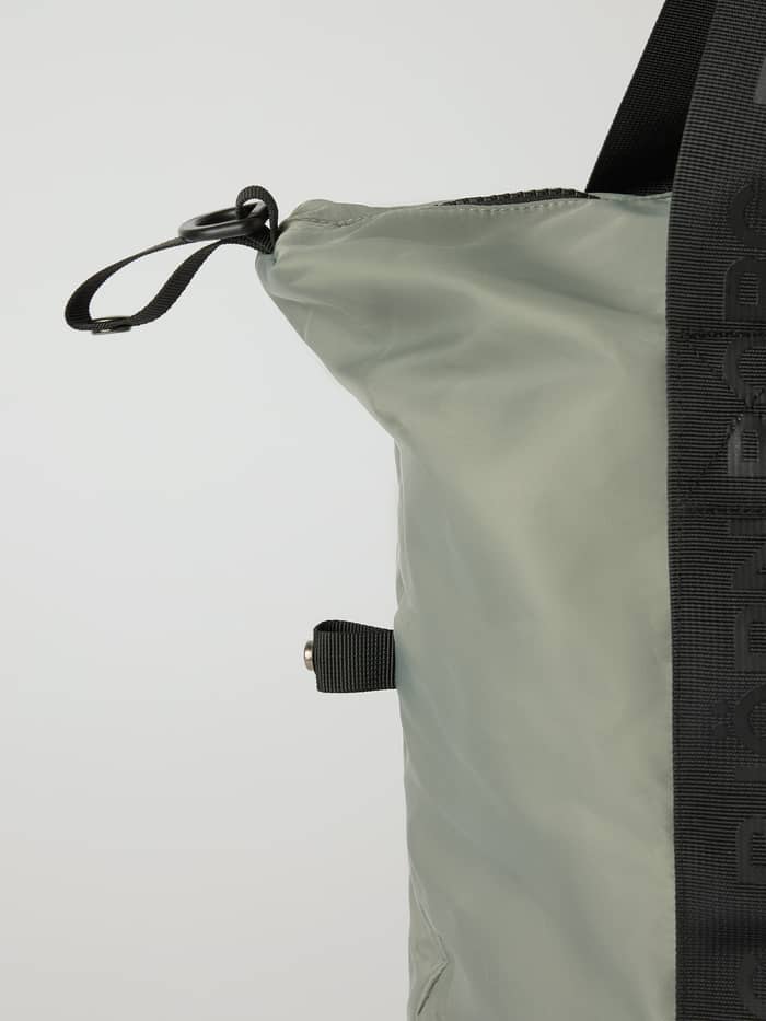 Side view of the Agave Green (Green) Borg Classic Sports Bag 28L for training, featuring black branded hand straps.