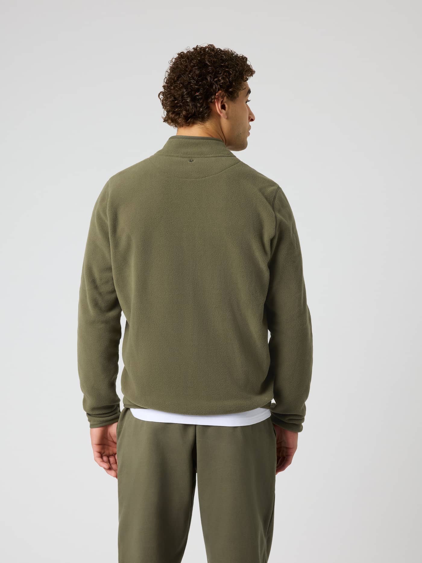 Back view of the Borg Full Zip Fleece in Kalamata (Green) featuring tennis ball embroidery for a premium training look. - Image 3