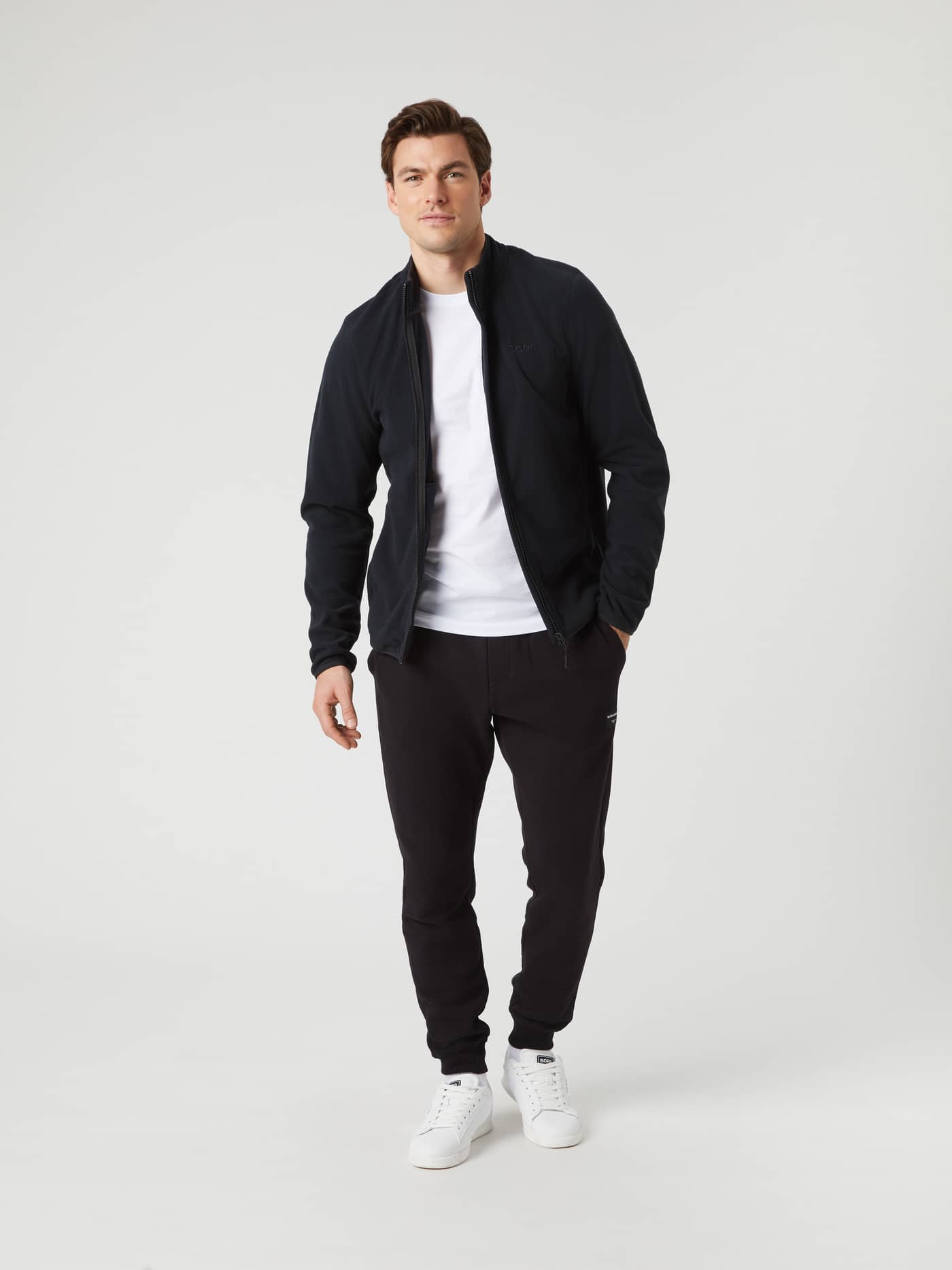 Full length shot of a model wearing the Björn Borg Borg Full Zip Fleece in black. - Image 4