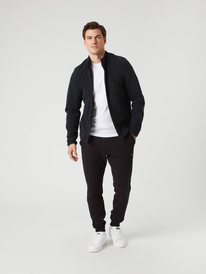Full length shot of a model wearing the Björn Borg Borg Full Zip Fleece in black. - Image 4