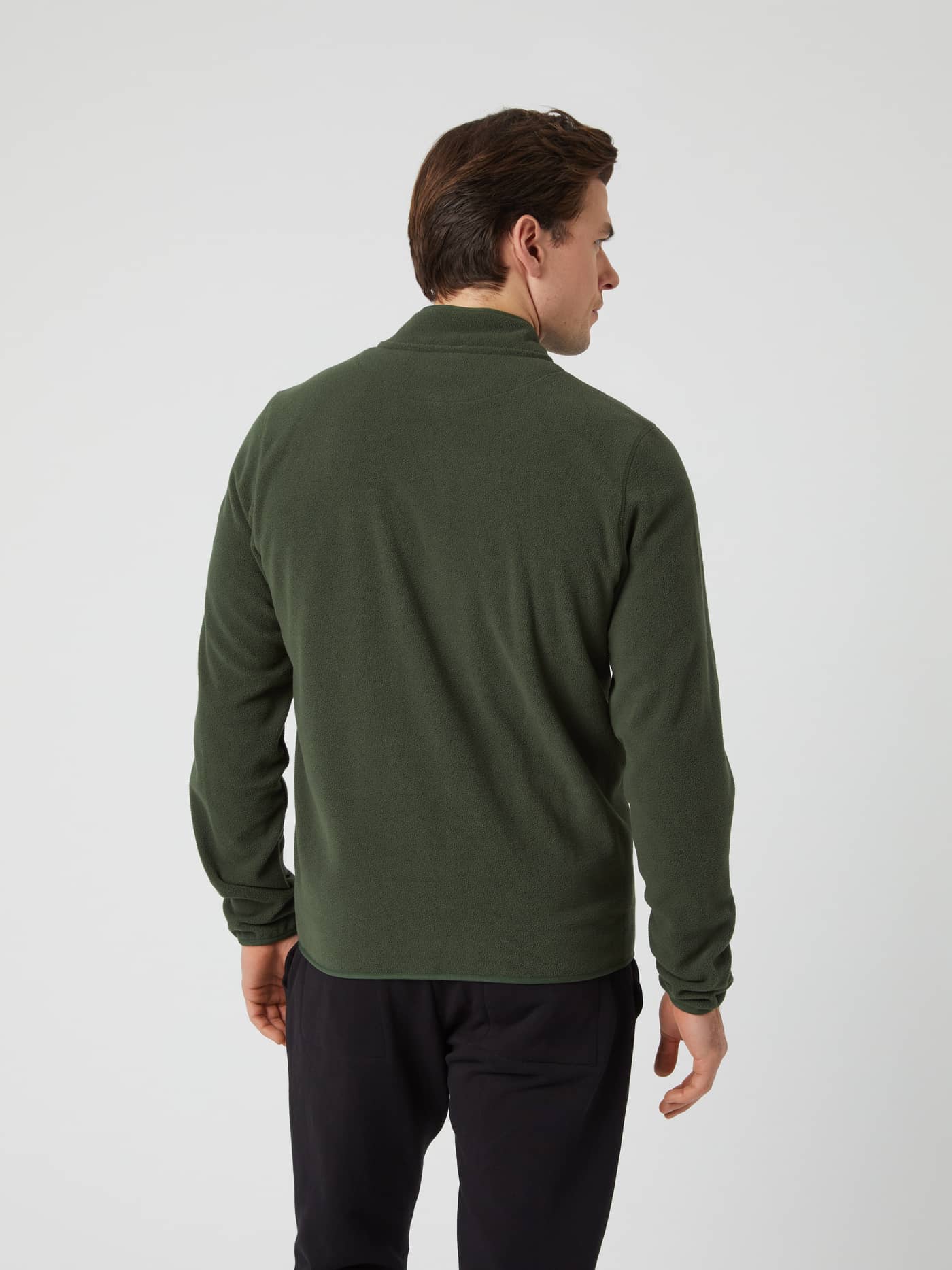 Back view of a man wearing the Borg Full Zip Fleece in green. - Image 2