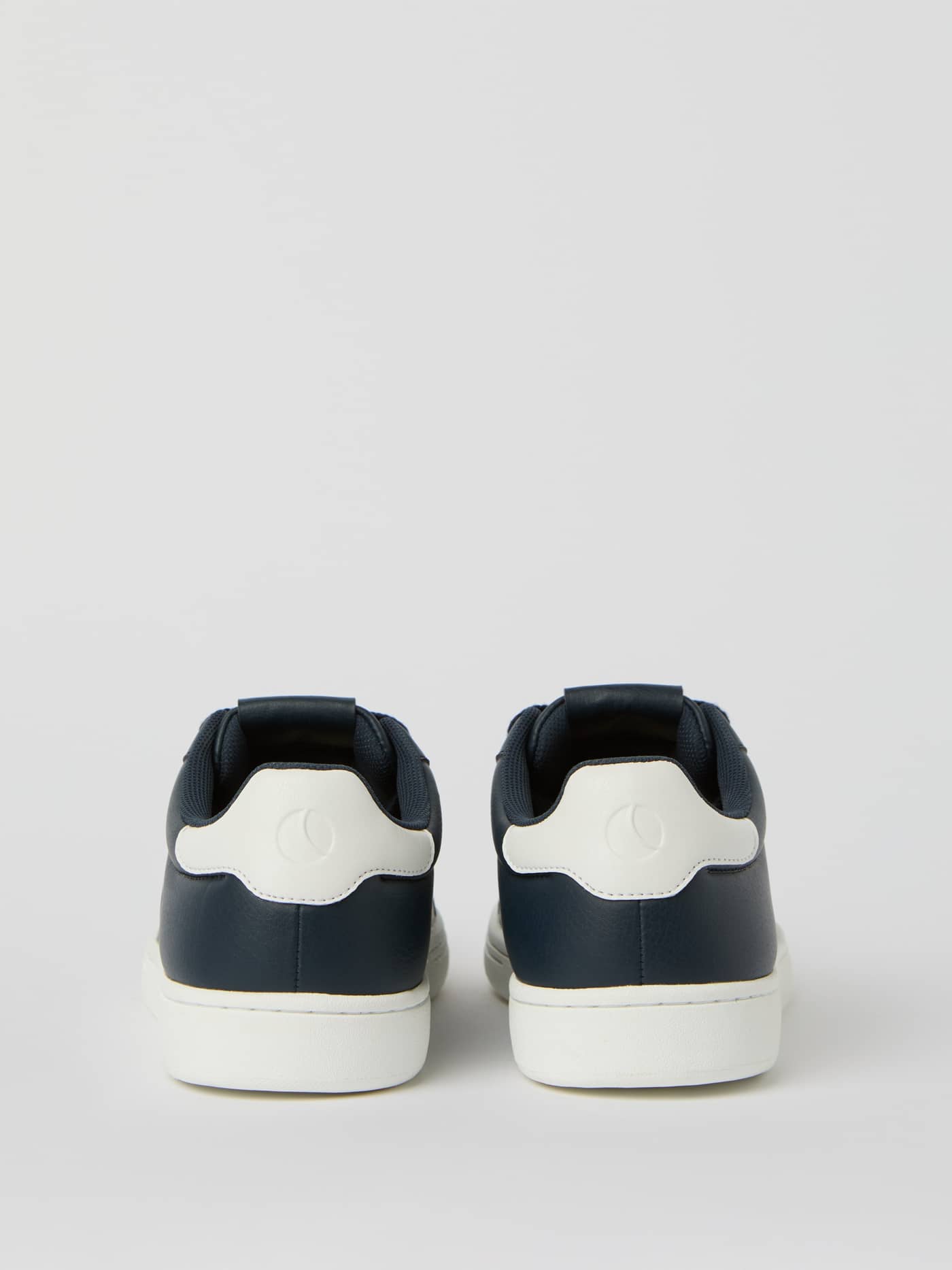 Back view of the Men's Cup Logo Sneakers in Navy, showing the tennis-inspired synthetic leather and white logo heel. - Image 3