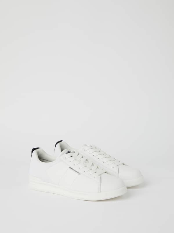 Side view of white Björn Borg Men’s Sneakers T2600 tennis shoes in synthetic leather and mesh with a navy logo.