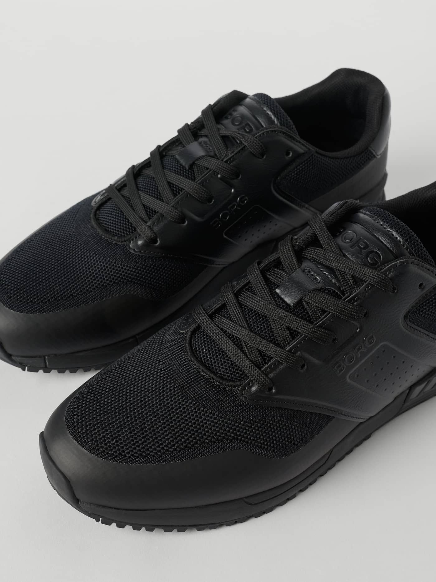 Black Men's Match Sneakers featuring breathable mesh, synthetic leather, and a black BORG logo for running performance. - Image 3