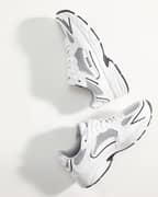 Women's Grand Sneakers in White with a black logo, mesh and synthetic leather for running and training performance.