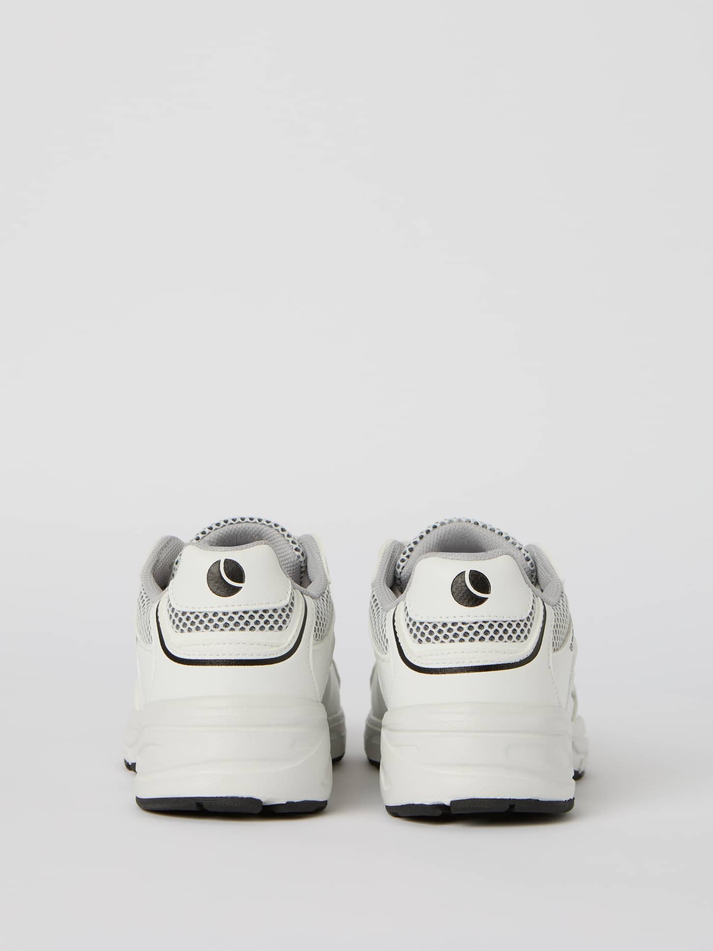 Back view of the white Women's Grand Sneakers with a black logo, featuring mesh for running style and performance. - Image 4