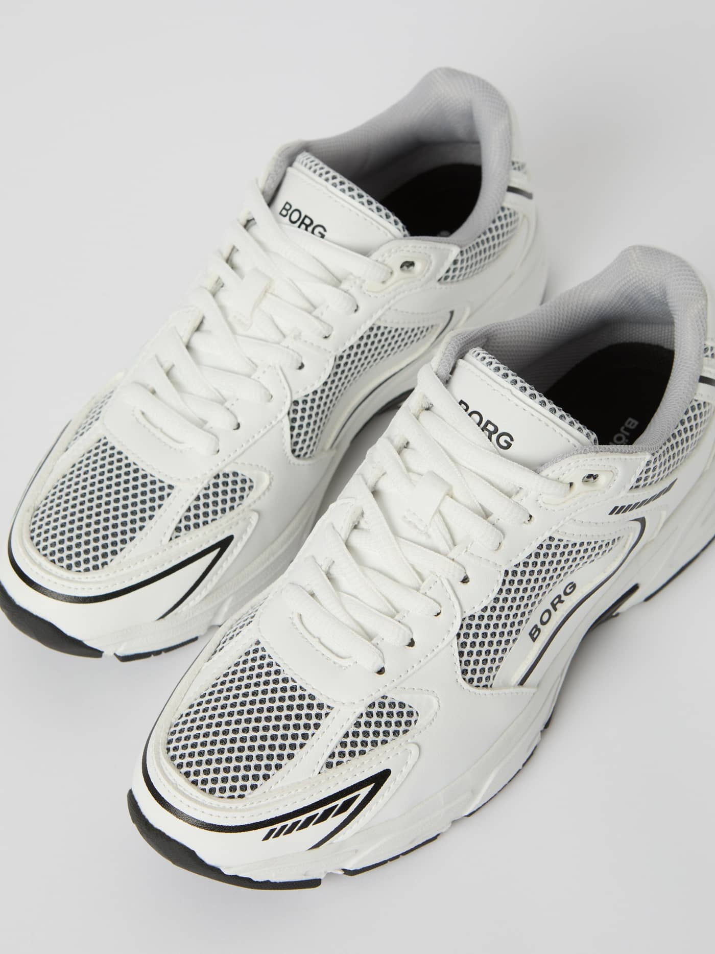 Women's Grand Sneakers in White, with synthetic leather, mesh, and black logos for stylish running and a comfortable fit. - Image 3