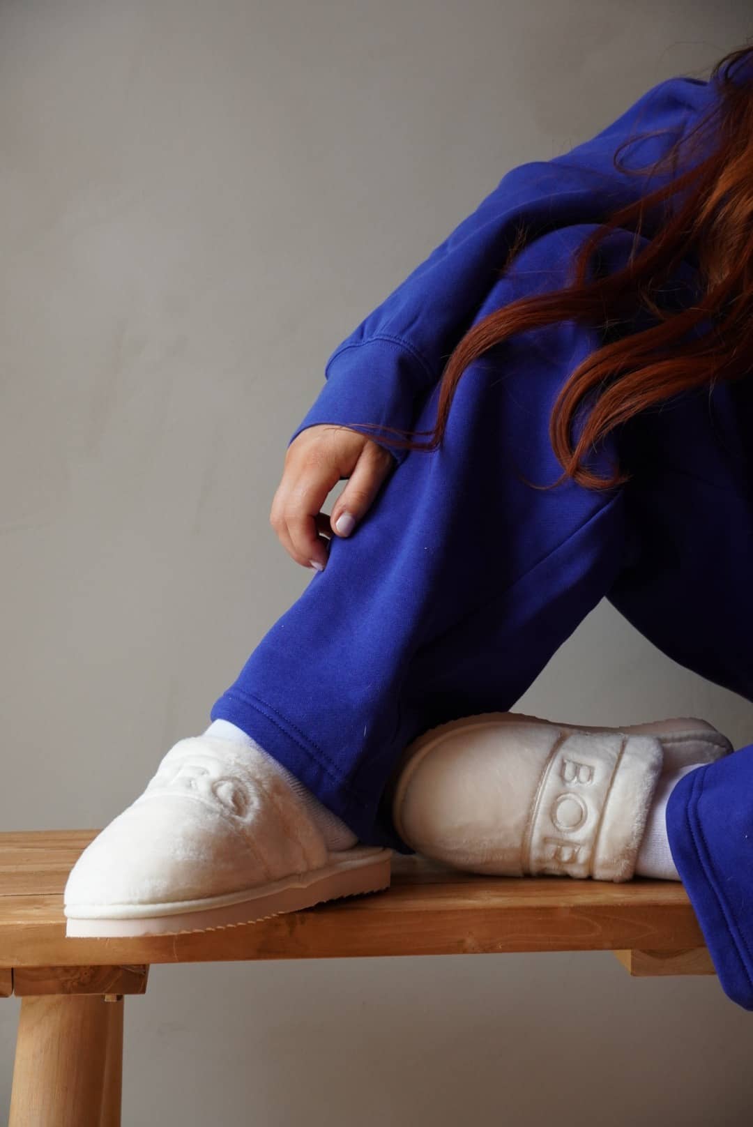 Beige Women's Slippers Homy in silky polyester, featuring a stylish fit and beige embroidered logo in a close-up. - Image 1