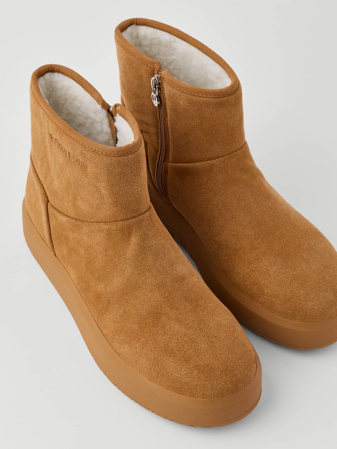 Women's Wooly Boots in Brown with a soft fluffy inside, side zipper, and a tonal embossed logo on synthetic leather. - Image 4